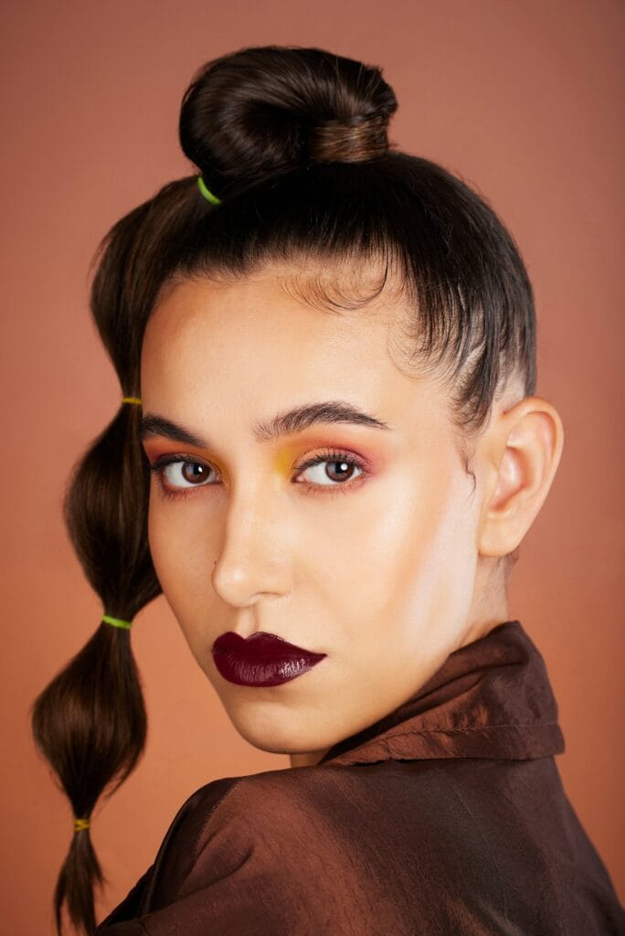 Hair, beauty with hair care and woman, makeup and cosmetics with lipstick, eye shadow and microblad